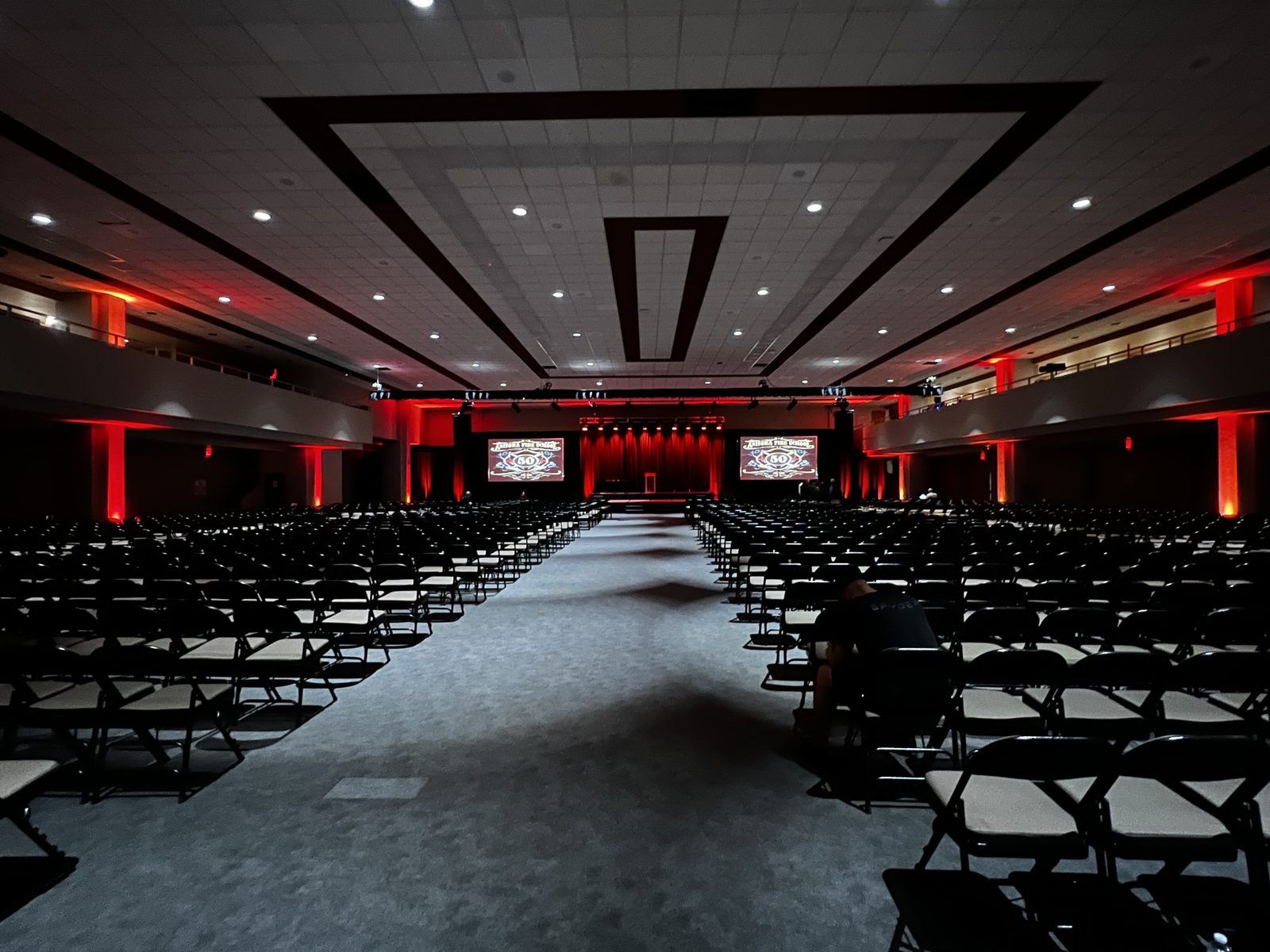 Arizona Fire School 50th Anniversary — House lighting, dual screens and theatrical stage design before doors.