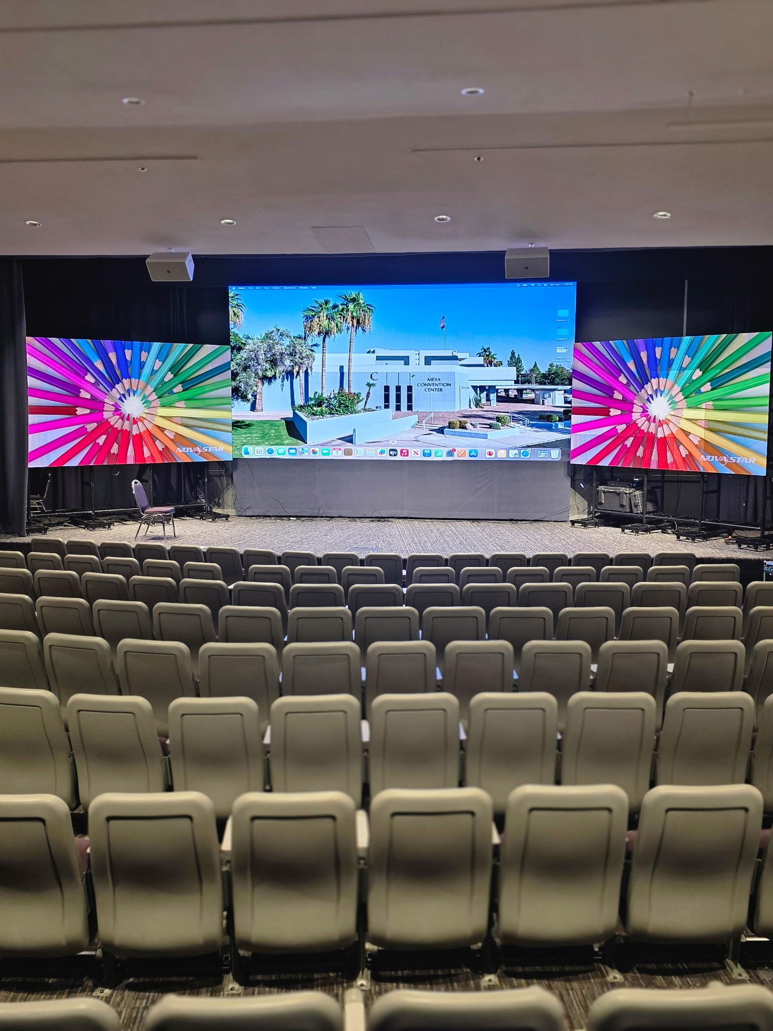 Mesa Convention Center — Dual LED video walls and stage lighting for a general session.
